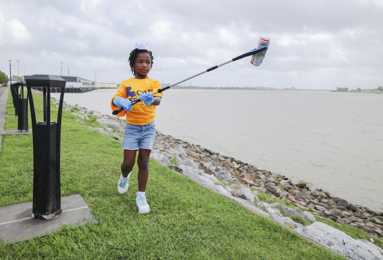 Nola.com – Volunteers clean the riverfront area in the French Quarter during Love the Boot Week